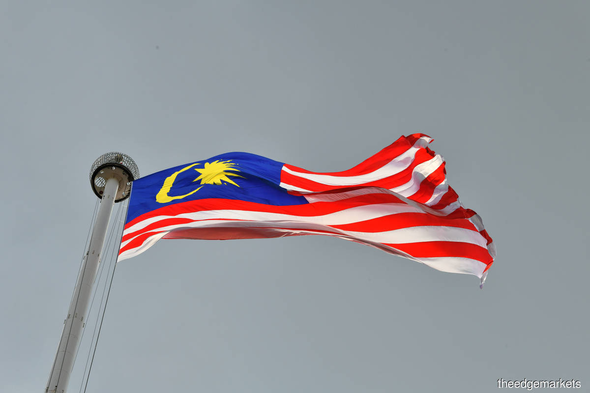 The Jalur Gemilang. The MoU also underlines the need to execute the terms of the 1963 Malaysia Agreement (MA63). However, no details are given on the matter. (Photo by Sam Fong/The Edge)